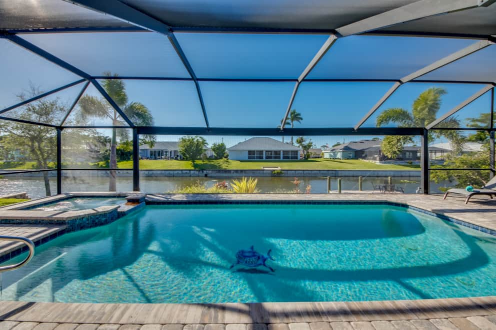 Saltwater pool with spa and canal view